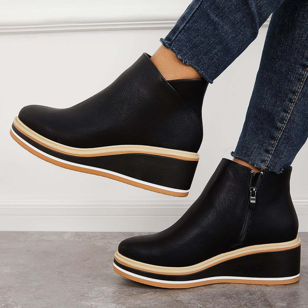 Fashion-forward women's ankle boots, with a trendy platform sole & prominent zipper detail.