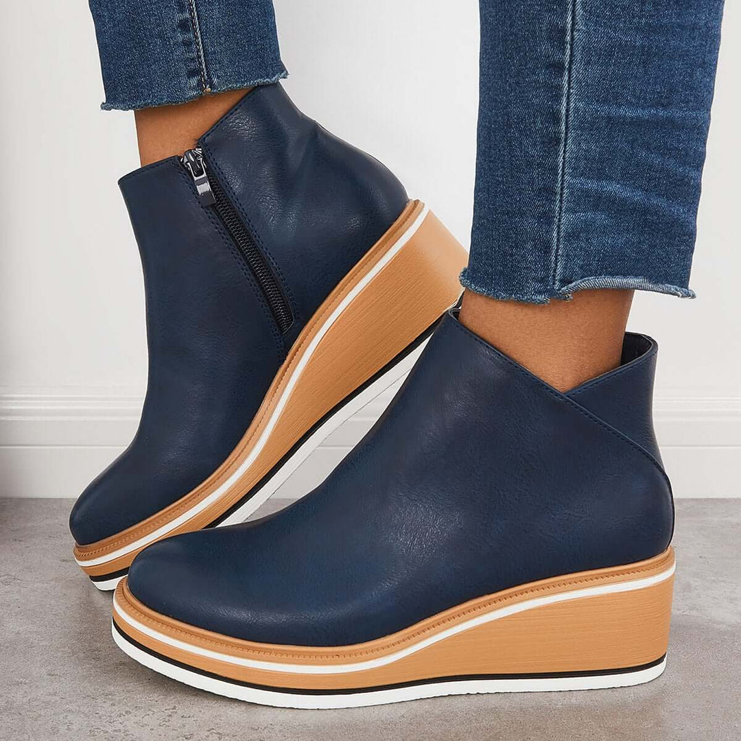 Modern women's zipper ankle boots, designed with a chunky platform sole for a trendy look.