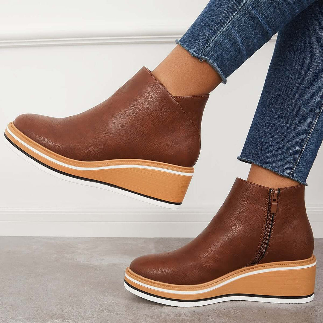 Fashion-forward women's trendy ankle boots, complete with zipper & sturdy platform sole.