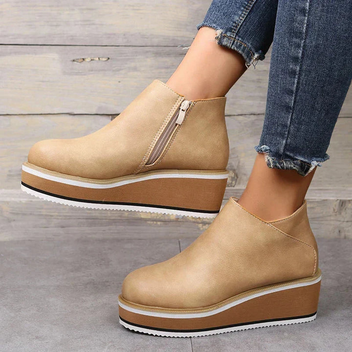 Everyday women's platform ankle boots, featuring a chic zipper detail & fashionable design.