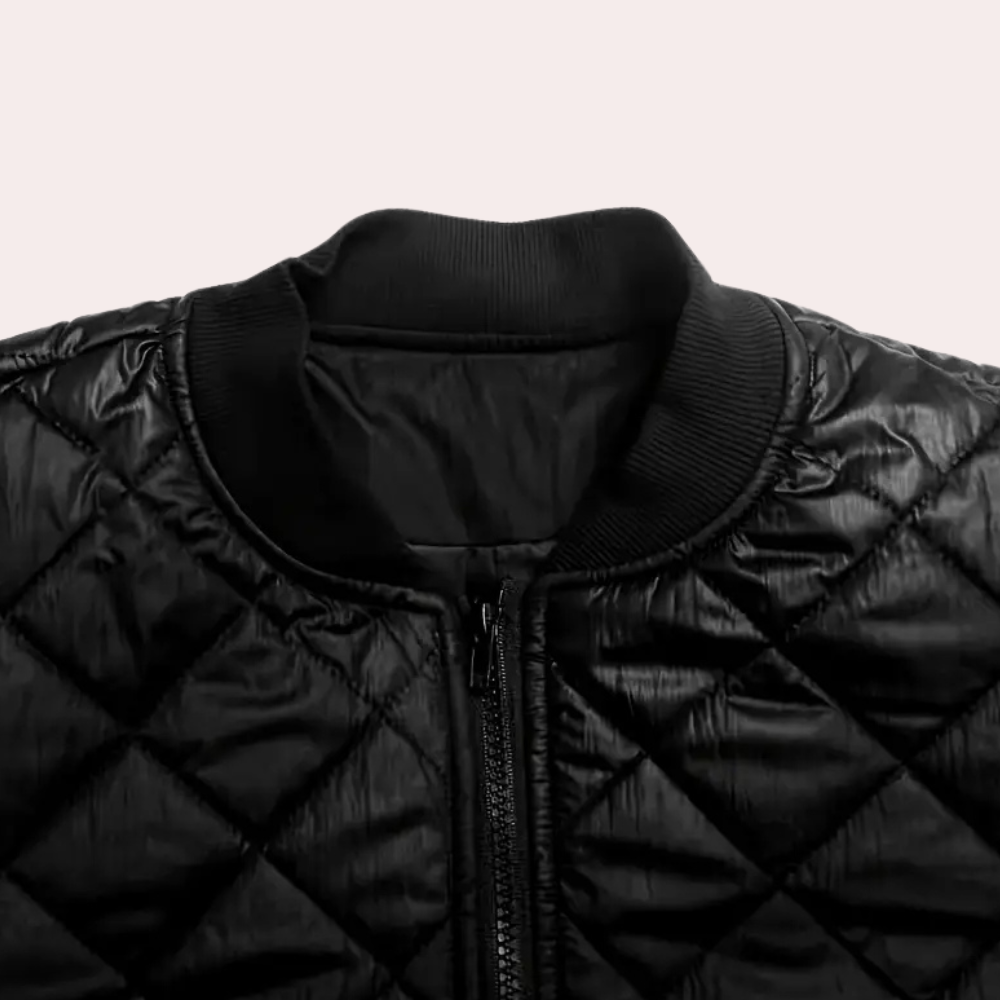 Sleek black women's bomber jacket with a full zip closure & practical pockets, essential trendy outerwear.