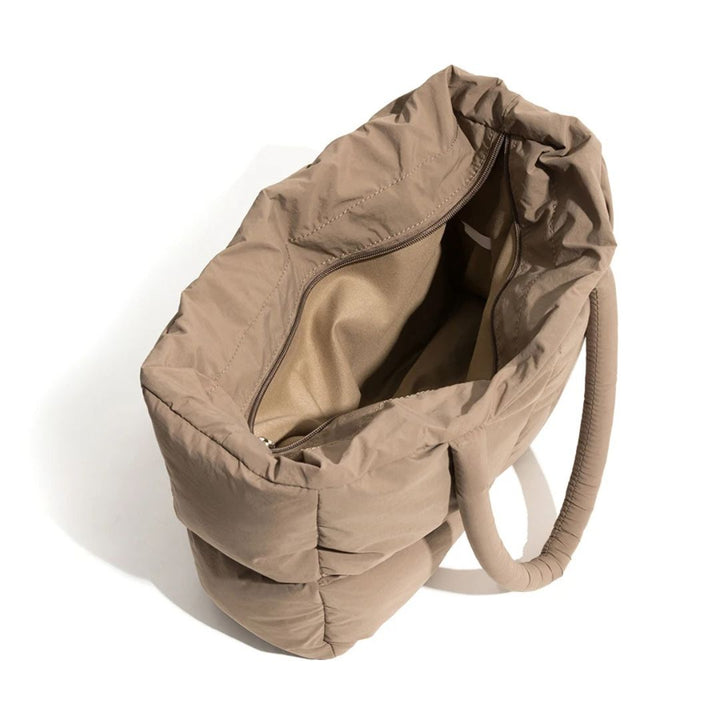 Trendy women's spacious black puffer shoulder bag, modern polyester nylon accessory for daily.