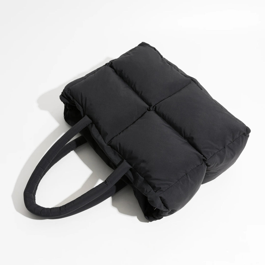 Trendy women's spacious black puffer shoulder bag, fashionable daily carryall accessory.