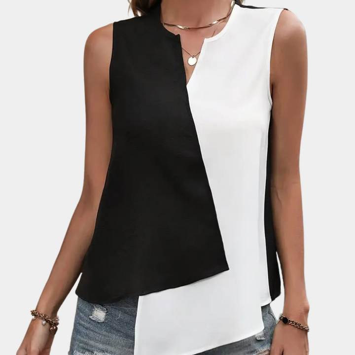 Comfortable black & white asymmetrical blouse for women, a versatile and elegant top for any fashion-forward look.