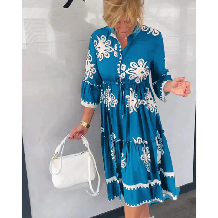 Stylish women's party dress, featuring a beautiful floral print and practical 3/4 sleeves for events.