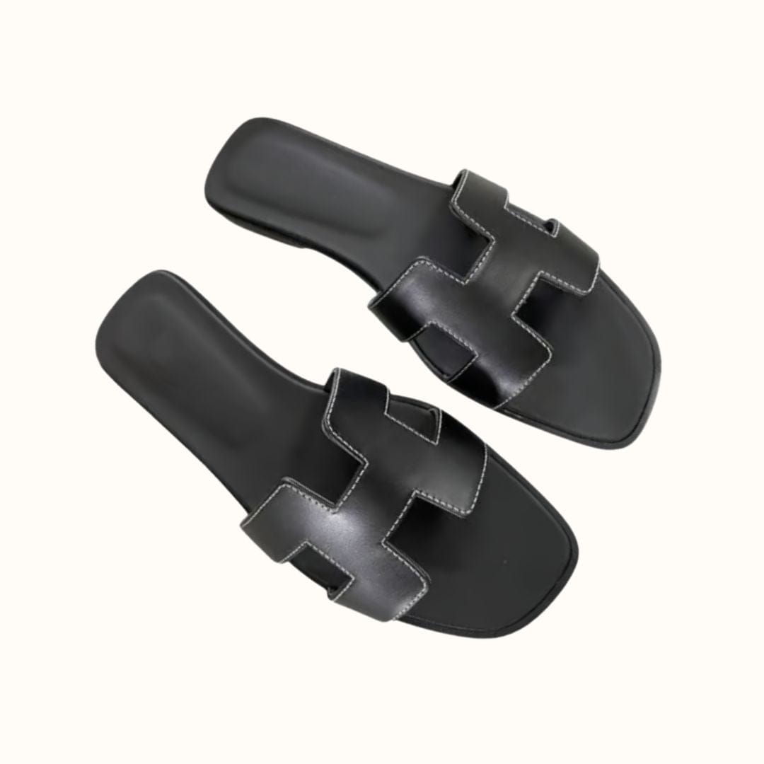 Flat H-profile slide sandals for women, trendy and comfortable for stylish casual wear.