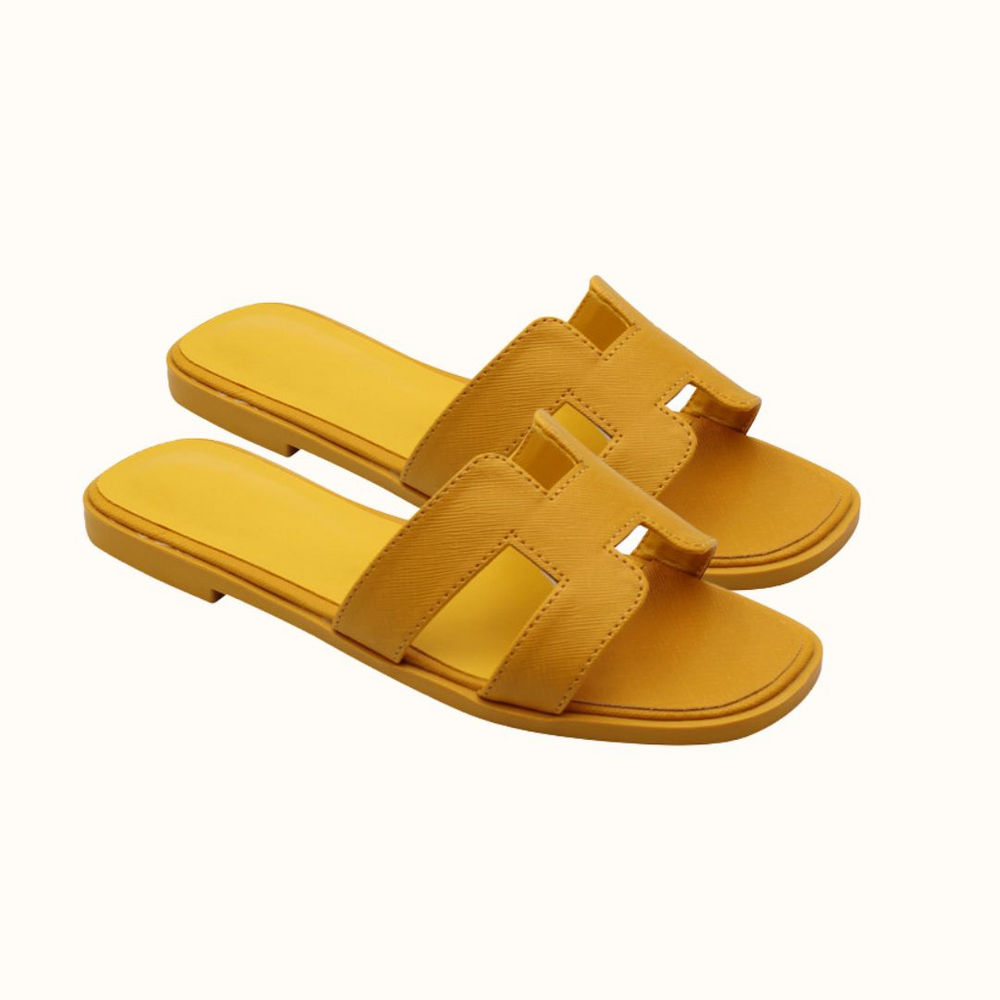 Trendy H-profile slide sandals, ideal women's summer shoes for comfort and casual fashion.