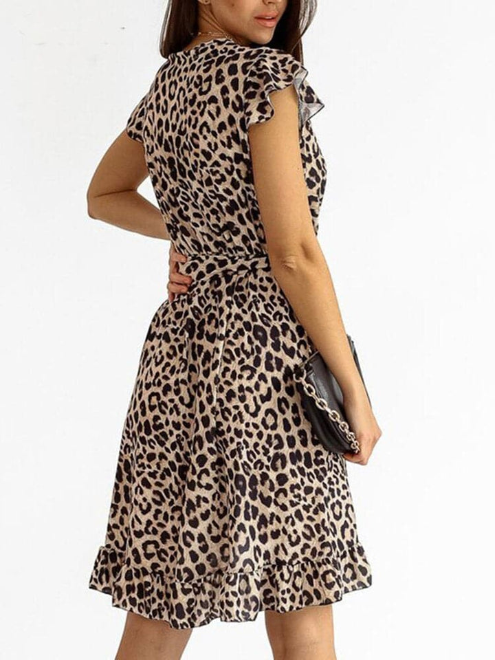 Women's trendy leopard print bodycon mini dress with V-neck, perfect for parties, summer nights, or evening wear.