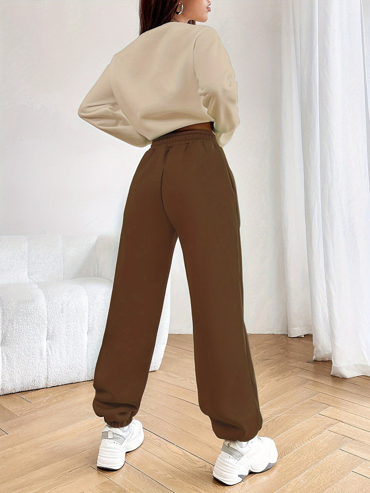 Trendy women's two-piece set featuring a chic letter print. Comfortable and fashionable casual wear.