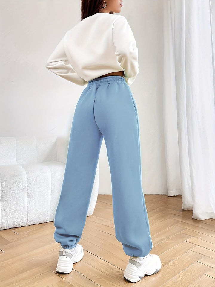 Women's casual two-piece jogging suit with a modern letter print. A comfortable daily outfit and loungewear.