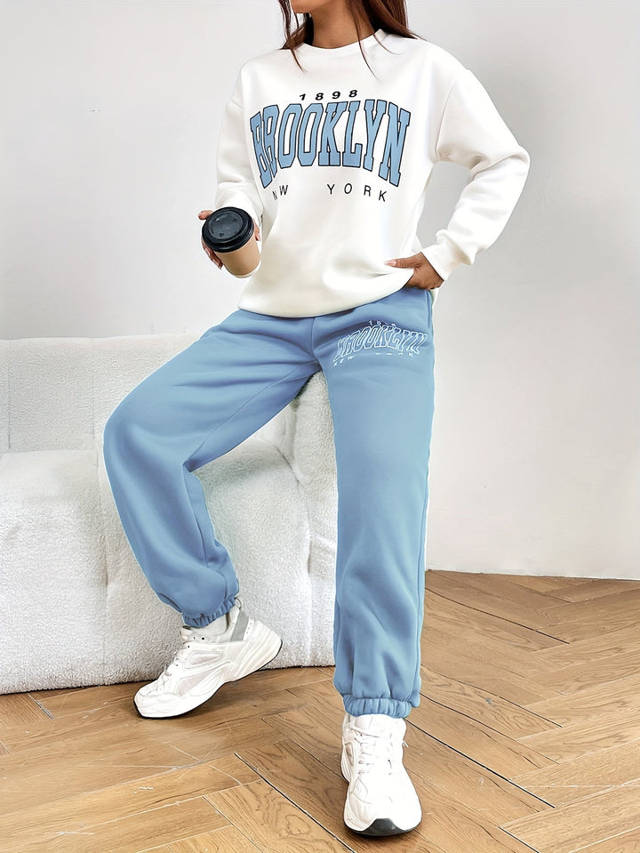 Versatile women's two-piece jogging suit with trendy letter print. Great for activewear, casual comfort, & daily wear.