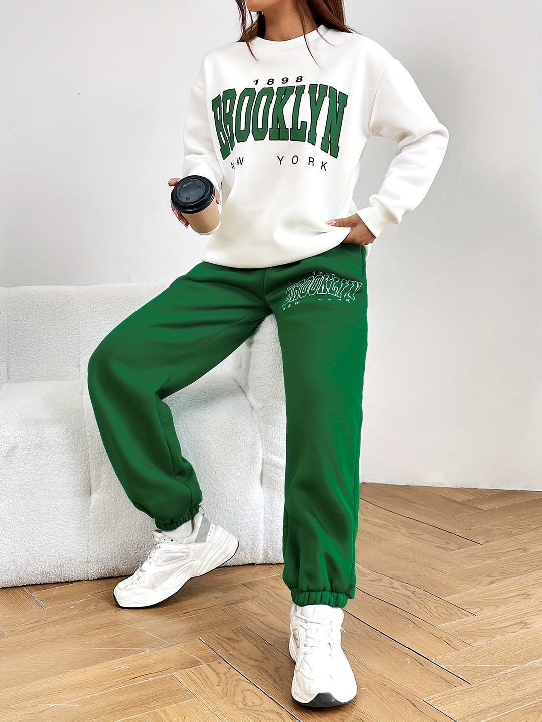 Modern women's two-piece tracksuit with a fashionable letter print, perfect for stylish activewear & daily outfits.