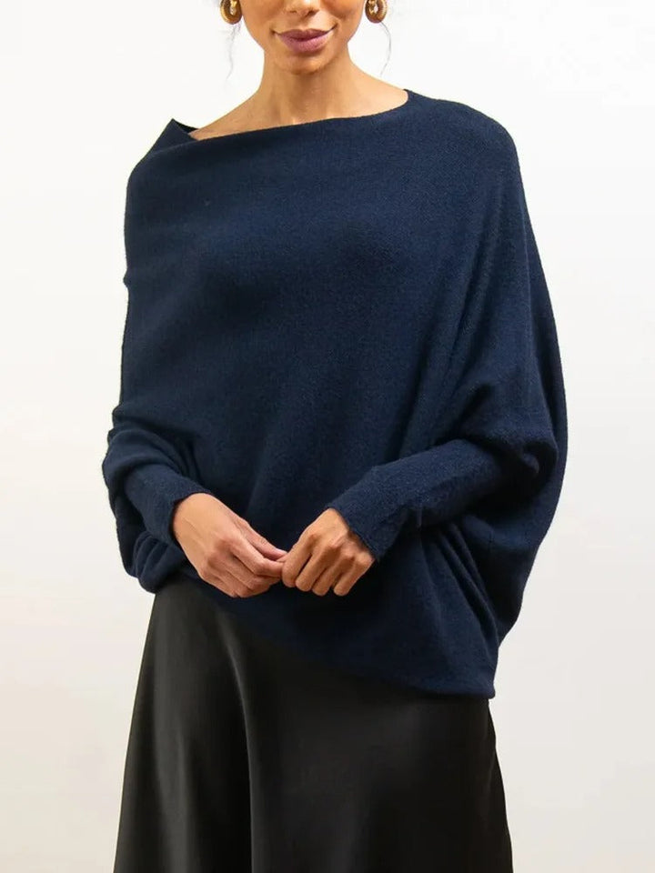 Fall/Winter women's off-shoulder knitwear, combining trendy style with cozy comfort.