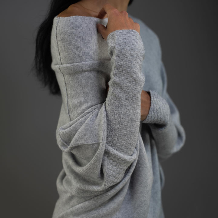 Versatile women's off-shoulder sweater, easily styled for casual or elegant looks.
