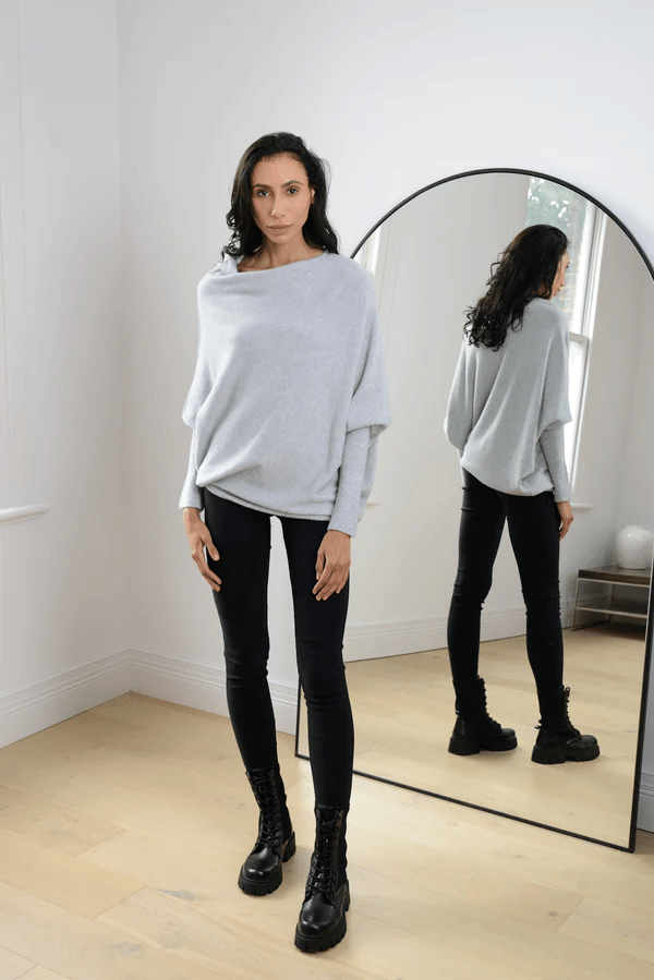 Elegant women's off-shoulder long sleeve top, perfect for stylish comfort in various colors.