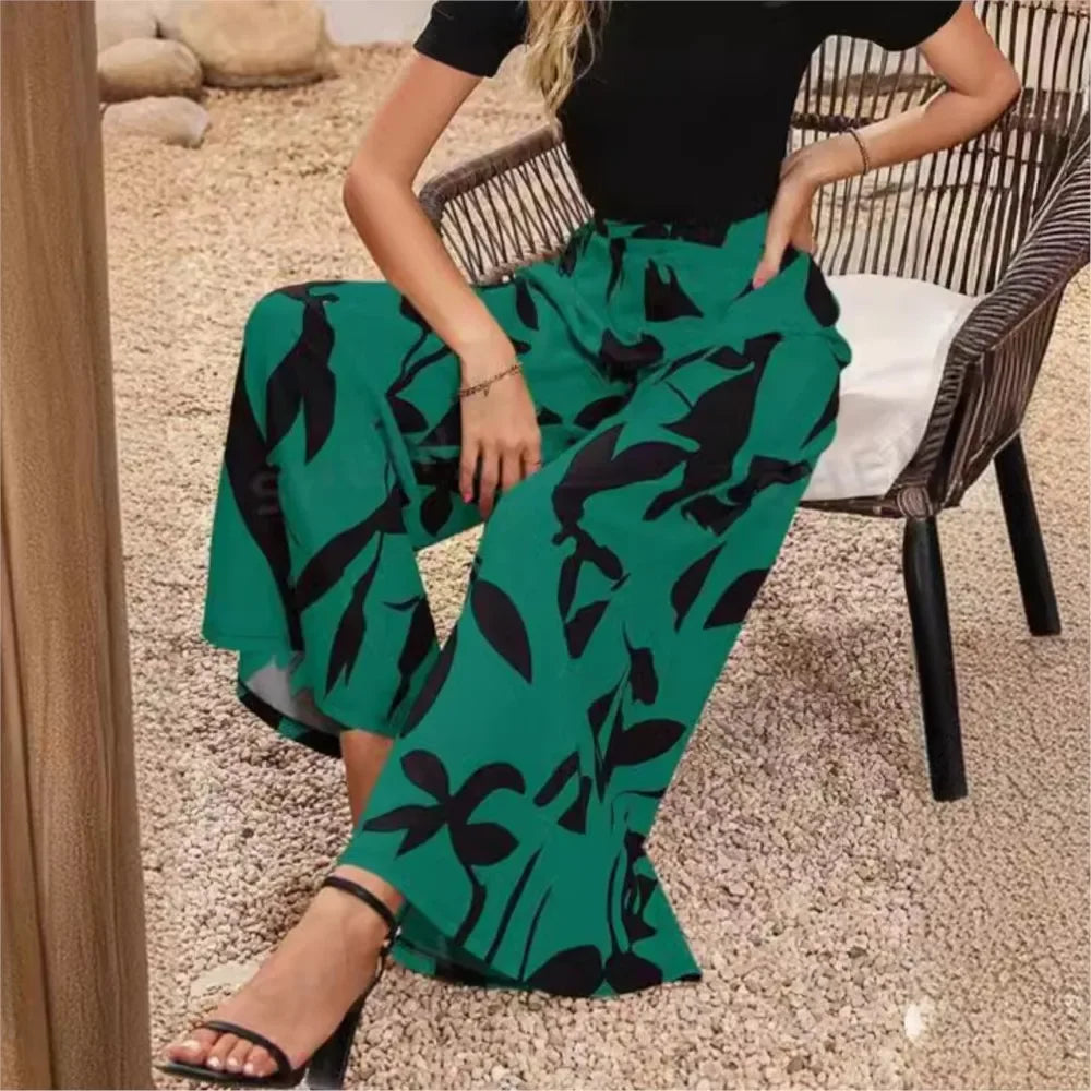 Flowy women's wide leg pants with a stylish print. Comfortable, loose fit casual trousers for spring and summer.