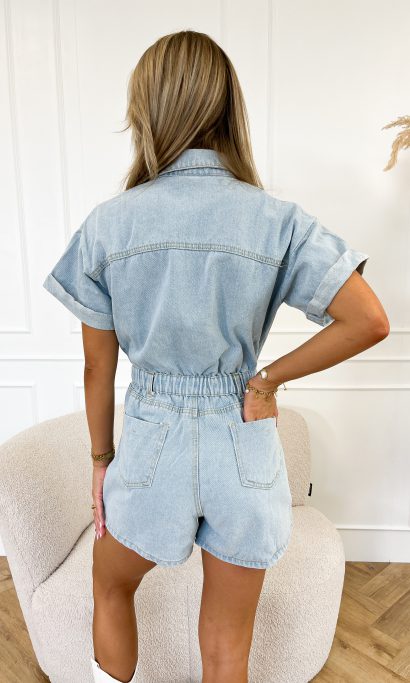 Chic women's short-sleeve denim jumpsuit with a button-front shirt design, a must-have for trendy summer fashion.