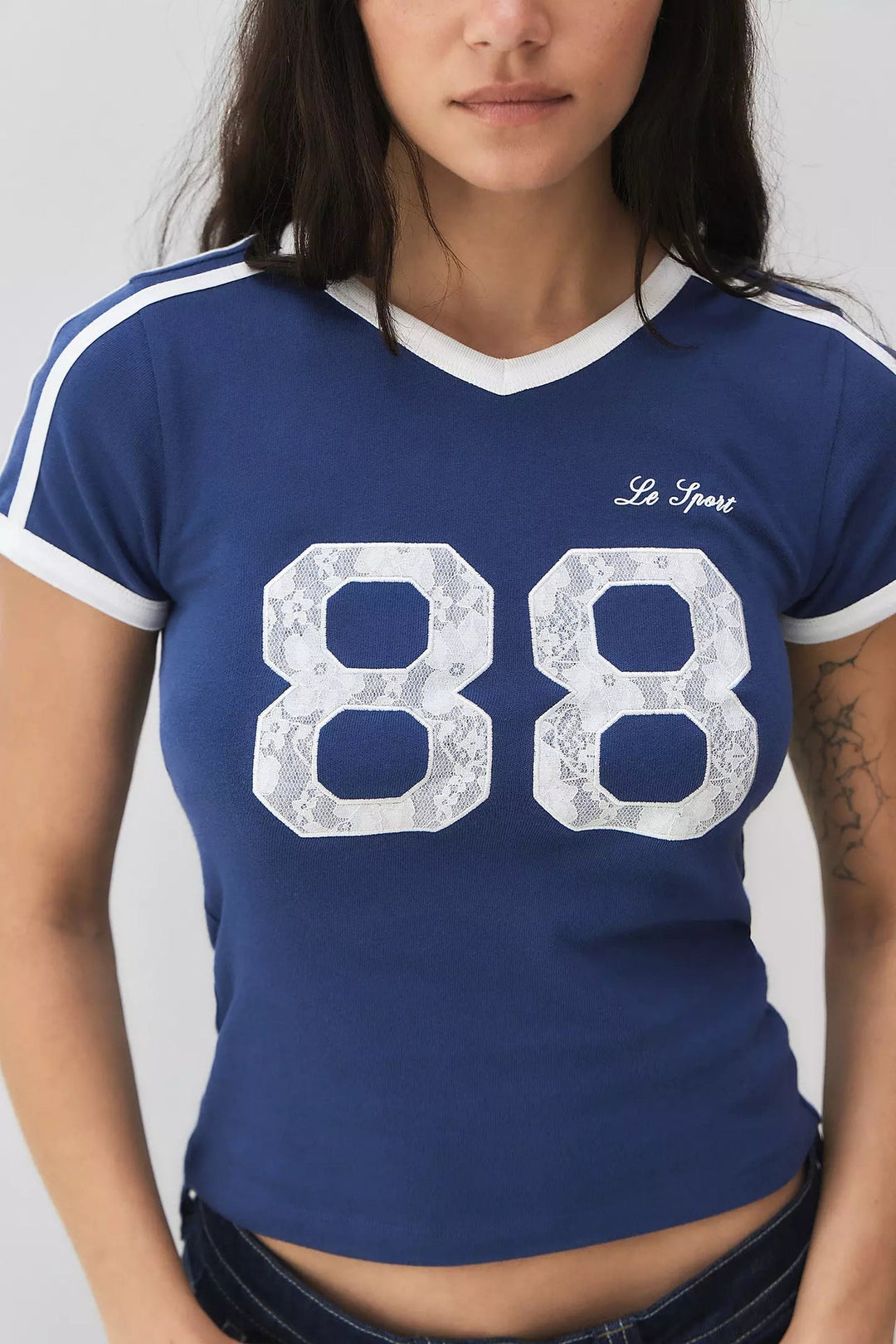 Blue women's t-shirt for summer fashion, featuring delicate lace and fashionable contrast short sleeves.