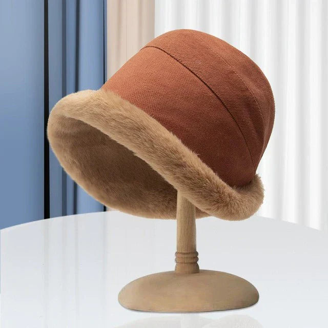 Warm women's winter hat, fleece-lined, featuring a chic design & faux fur for cozy cold weather style.