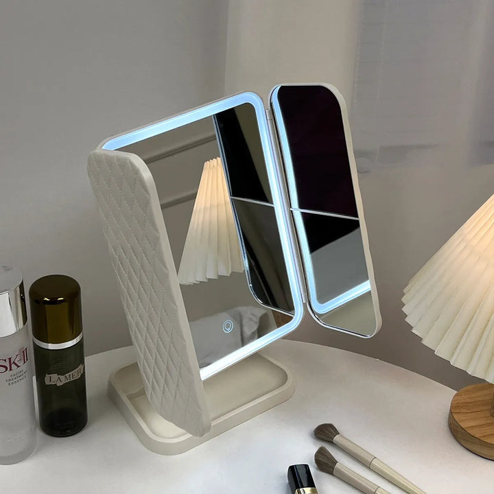 Women's trifold LED vanity mirror providing clear, adjustable illumination for precise makeup & grooming.