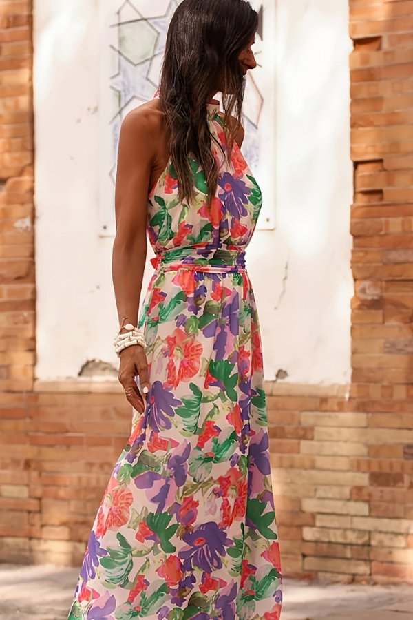 Stylish women's tropical summer dress, a long halter design with vibrant patterns, perfect for resort evenings.