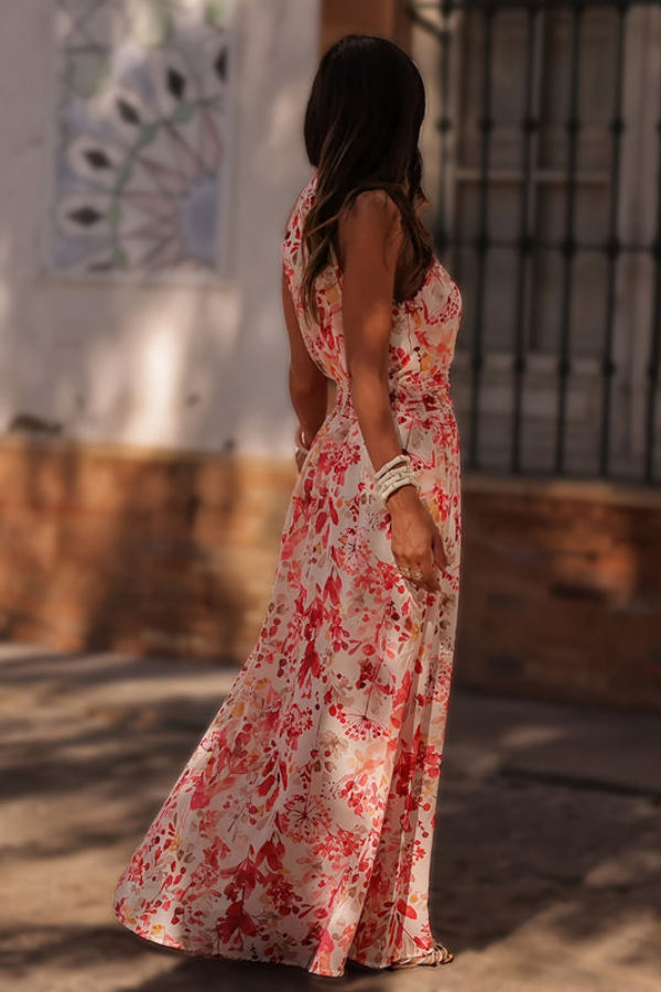 Flowing tropical maxi dress with a flattering halter neckline & keyhole detail, perfect for beach and resort.