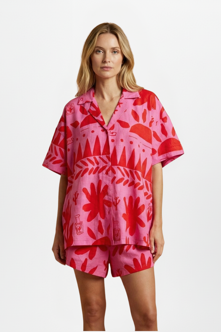 Relaxed fit tropical print shorts set for women. Features a stylish camp collar shirt & comfortable matching shorts. Casual chic.