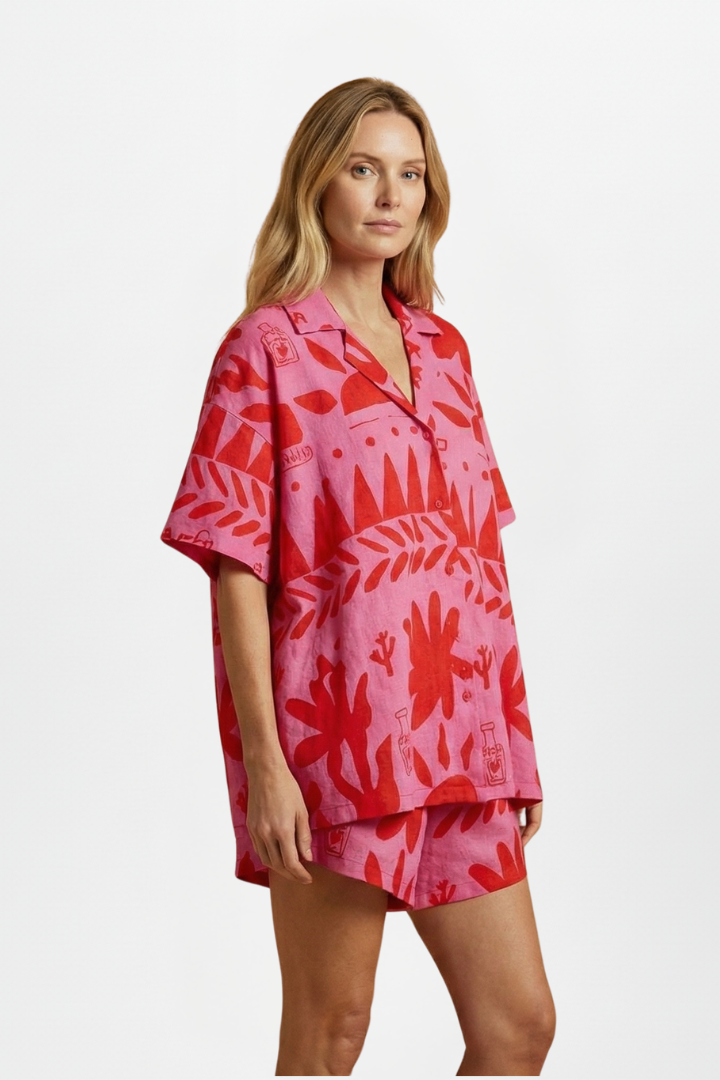 Tropical print camp collar shirt & shorts set for women. Relaxed fit summer outfit, perfect for resort or beachwear.