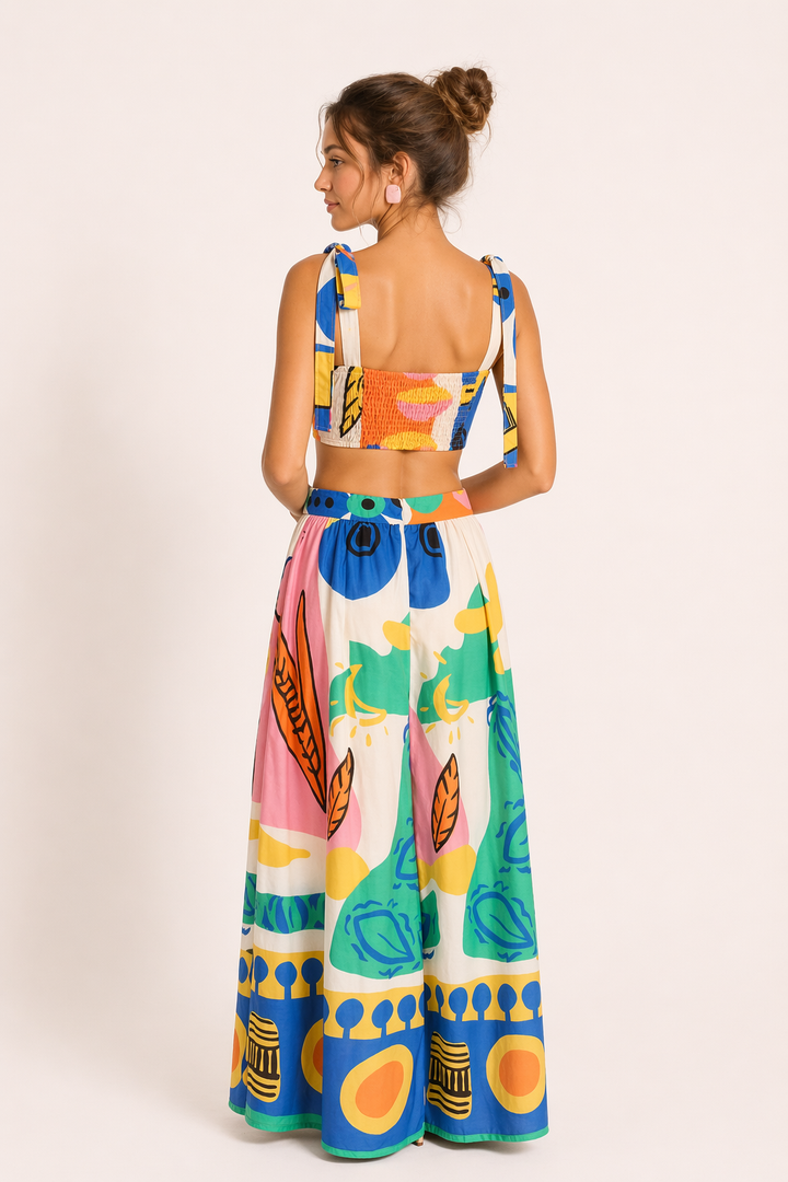 Sleeveless tropical print crop top and flowing maxi skirt two-piece set for beach fashion & summer outfits.