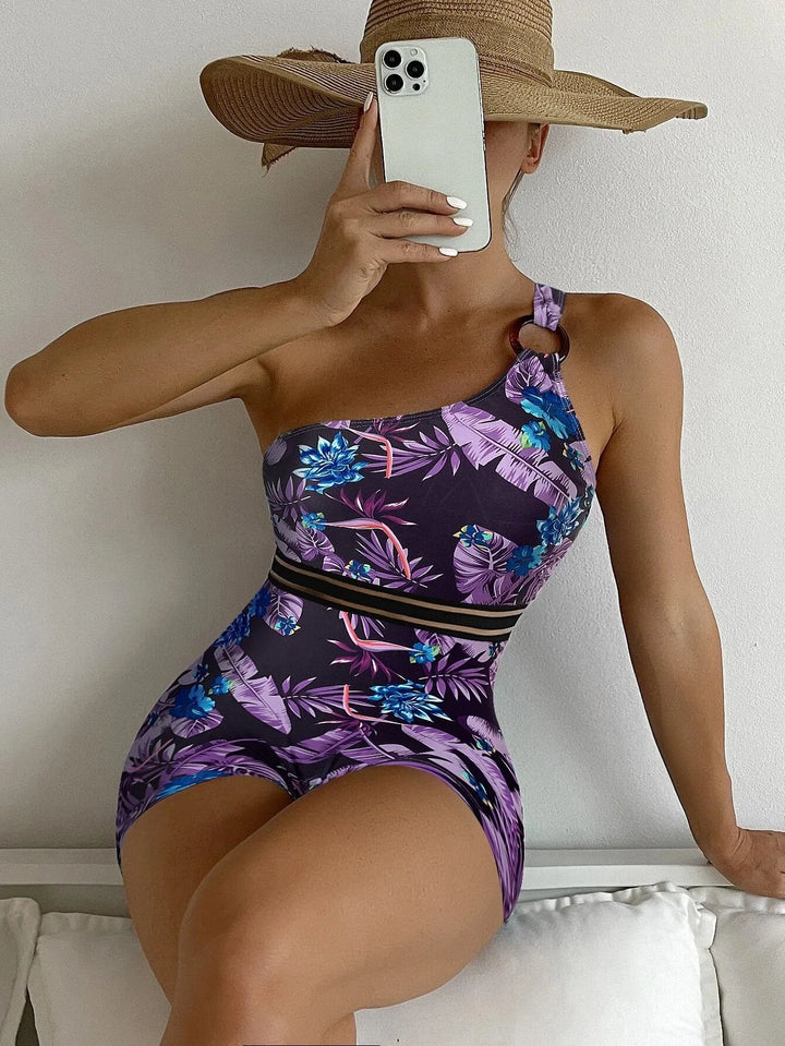 Women's tropical print high-waisted one-piece swimsuit, perfect for summer beachwear and vacation.