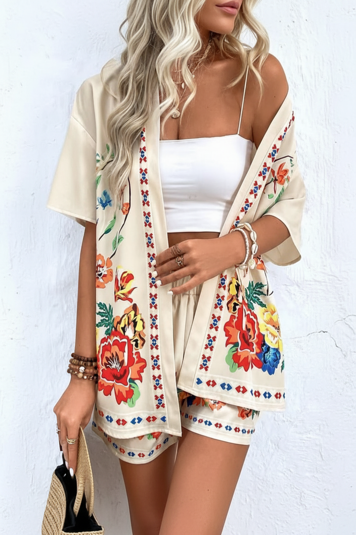 Women's vibrant tropical floral print two-piece shorts set, stylish summer vacation wear.
