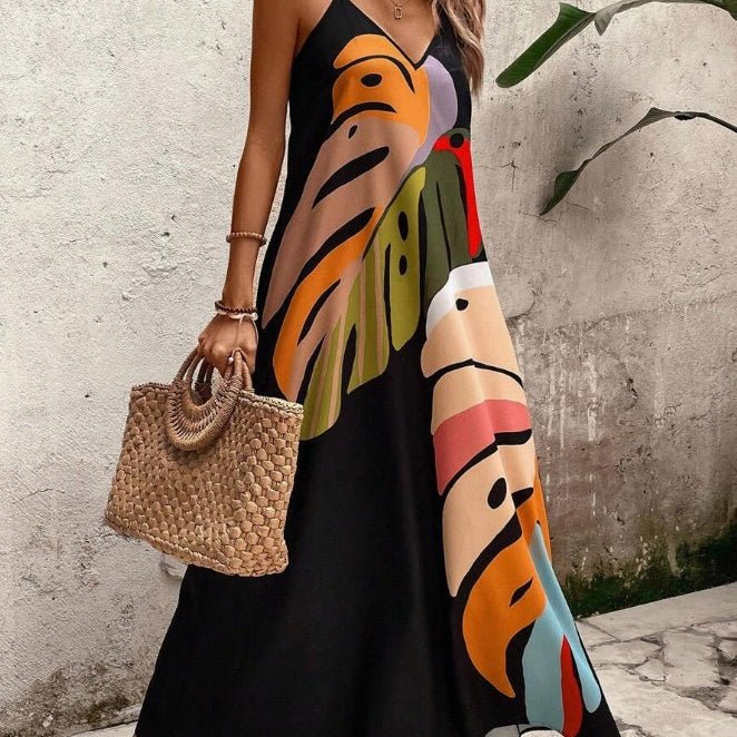 Women's tropical sleeveless maxi dress with leaf print, ideal for summer vacations, beach, and resort wear.