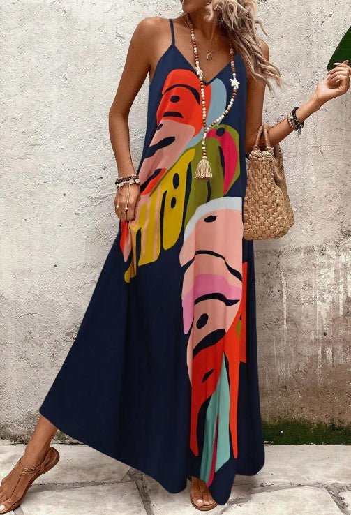 Elegant women's tropical leaf print long sleeveless maxi dress, perfect for vacation, beach, and resort outfits.