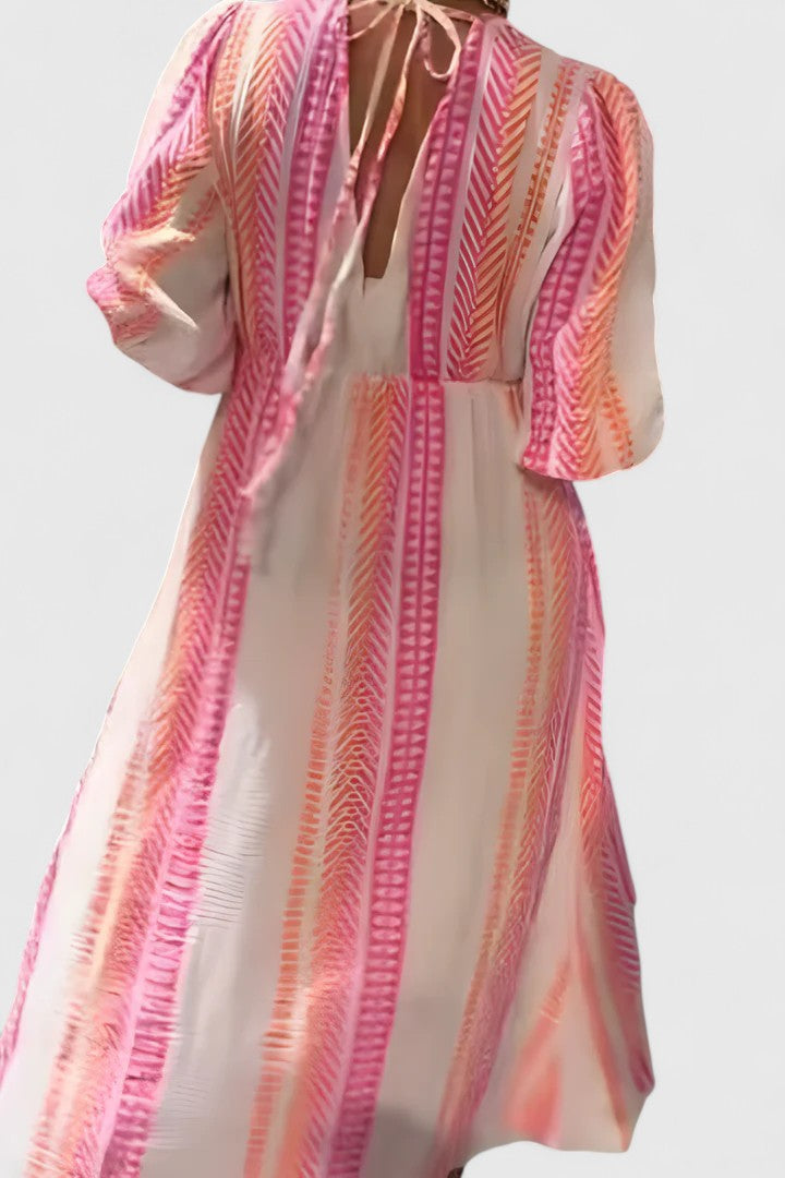 Women's vibrant tropical stripe maxi dress with V-neck, puff sleeves. Stylish summer & resort fashion.