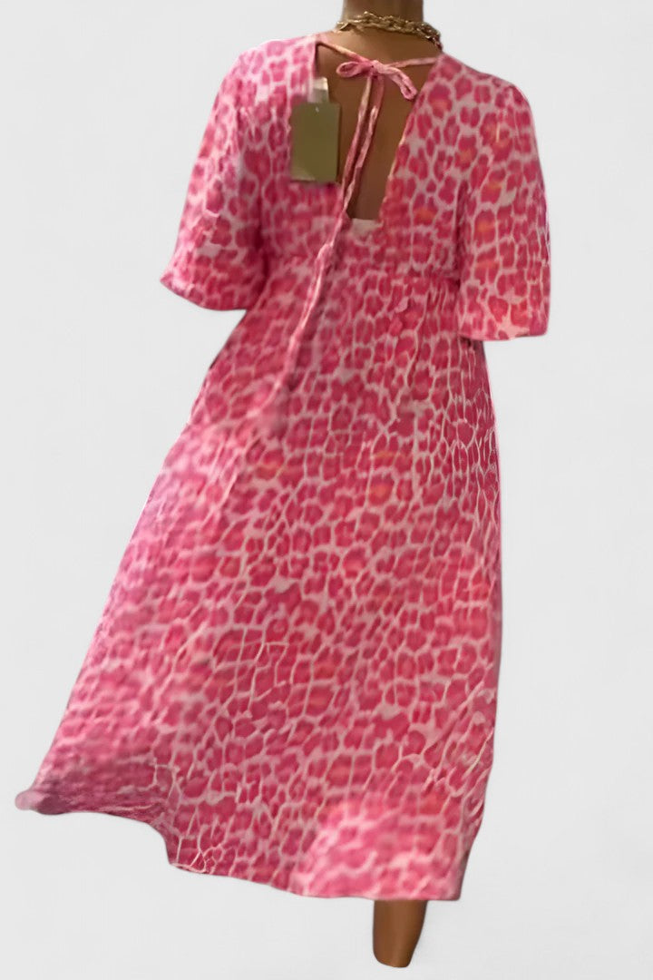 Striped tropical print women's maxi dress. Features a flattering V-neck, puff sleeves, and empire waist for summer.