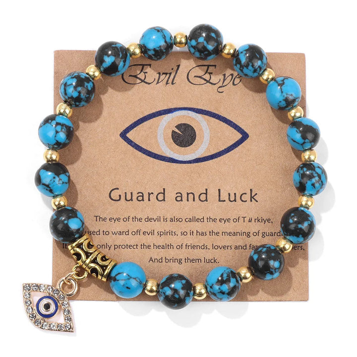 Close-up of Turkish Evil Eye pendant bracelet with striking blue sodalite protection beads. Womens spiritual jewelry.