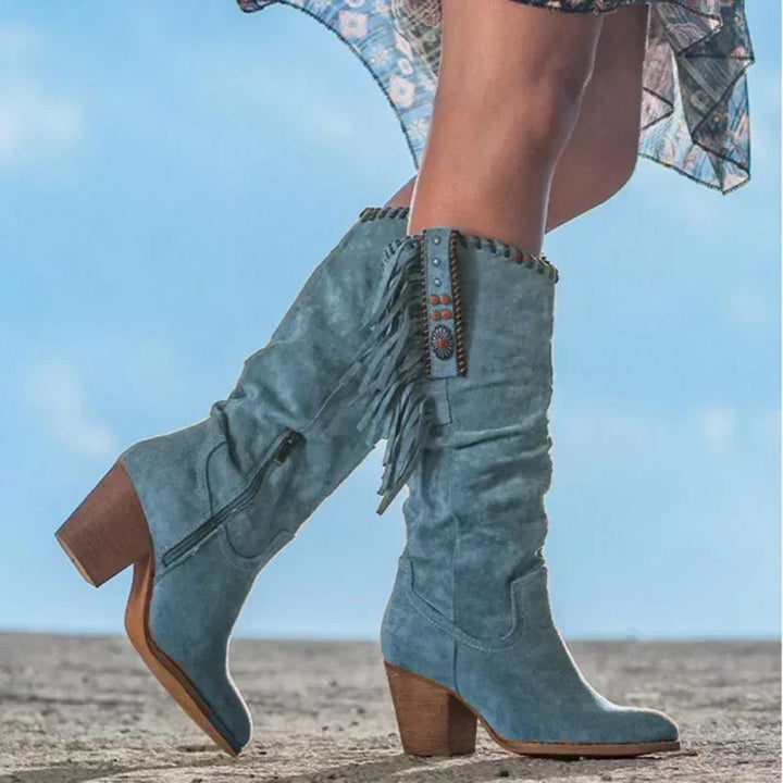 Distinctive women's turquoise fringe western mid-calf boots with eye-catching stud details & a comfortable block heel.