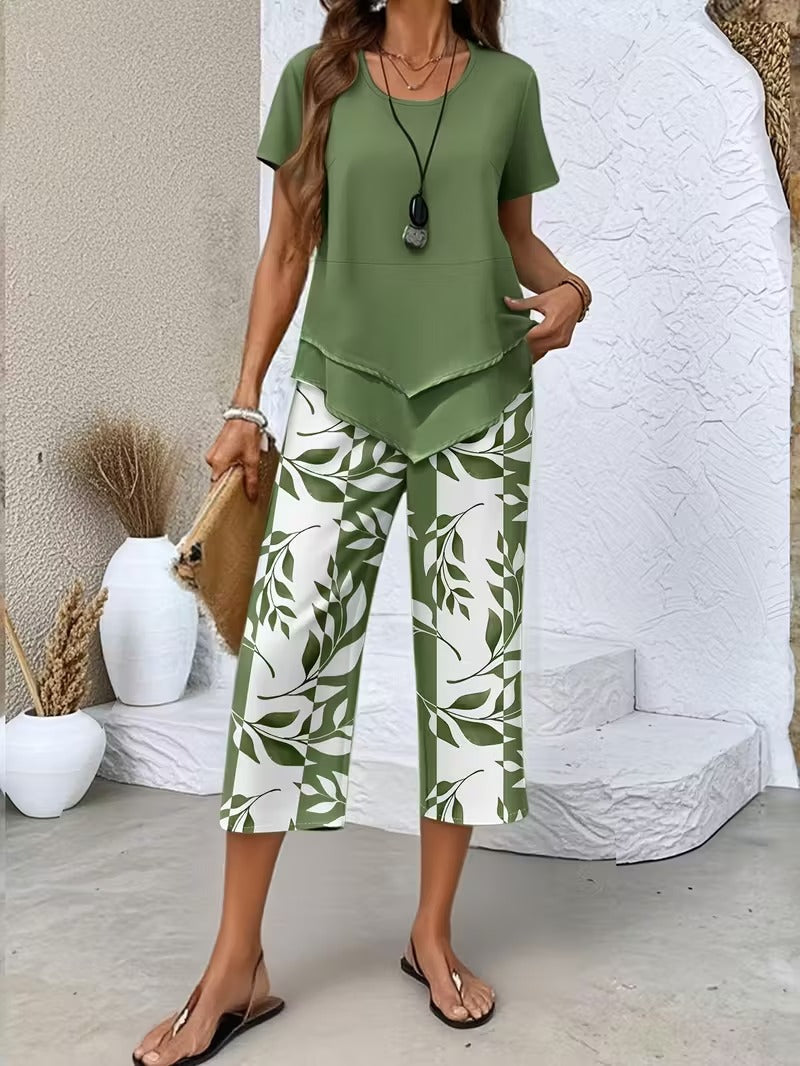 Women's two-piece leaf print outfit with a relaxed top and cropped pants. Perfect for summer casual wear.