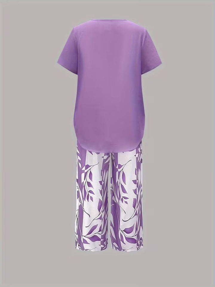 Chic women's botanical print casual outfit. Top and cropped pants set for summer & travel.