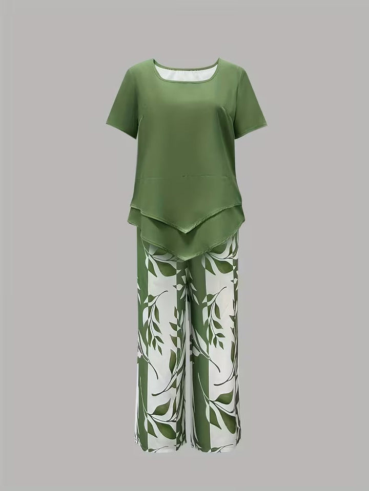 Botanical print women's outfit: loose-fit top and cropped trousers. Comfortable summer two-piece set.