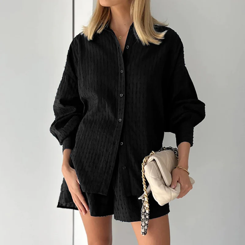 Breezy women's two-piece shorts set, ideal summer loungewear with stylish lantern sleeves.