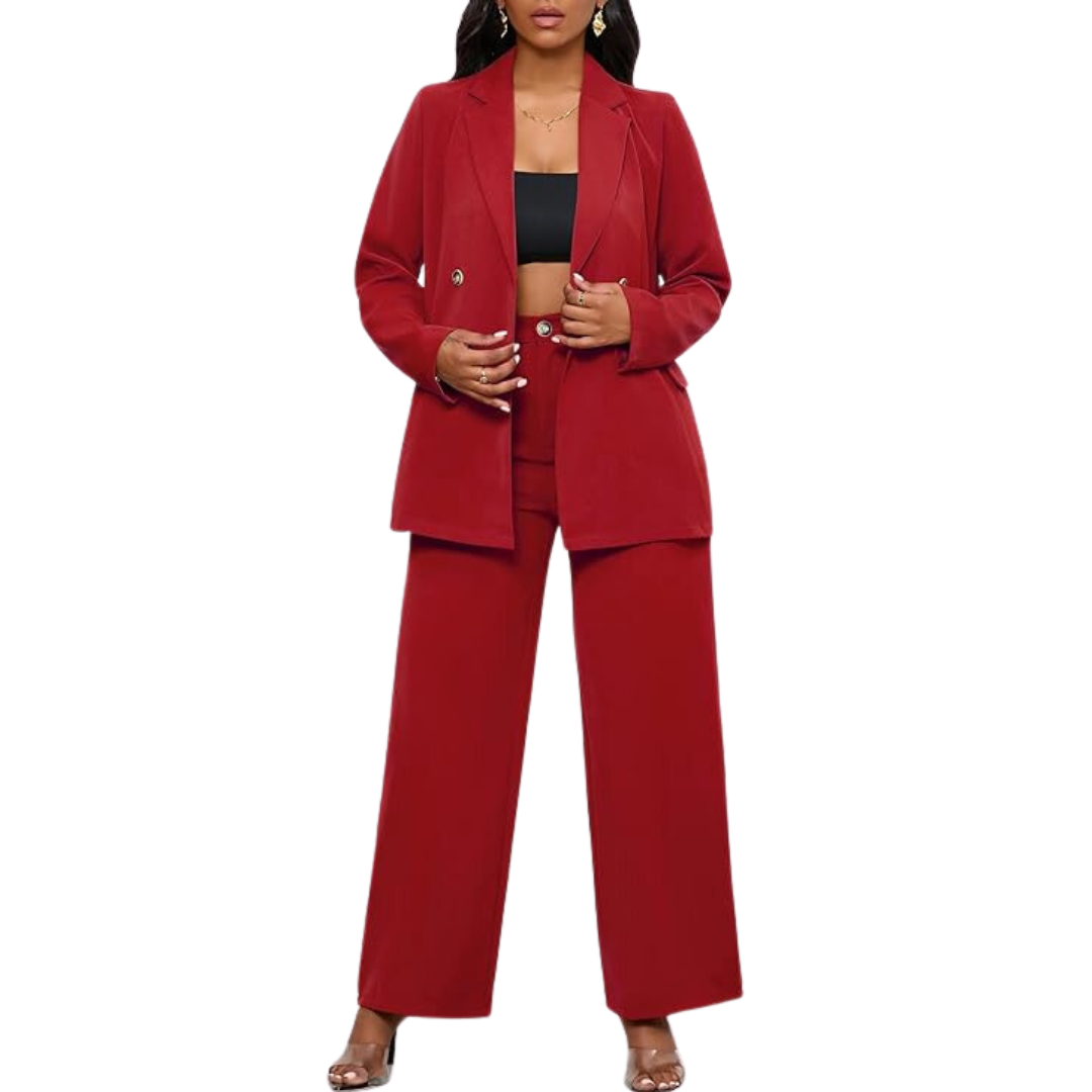 Front view of a woman posing confidently in a two-piece blazer and wide leg trousers business suit.