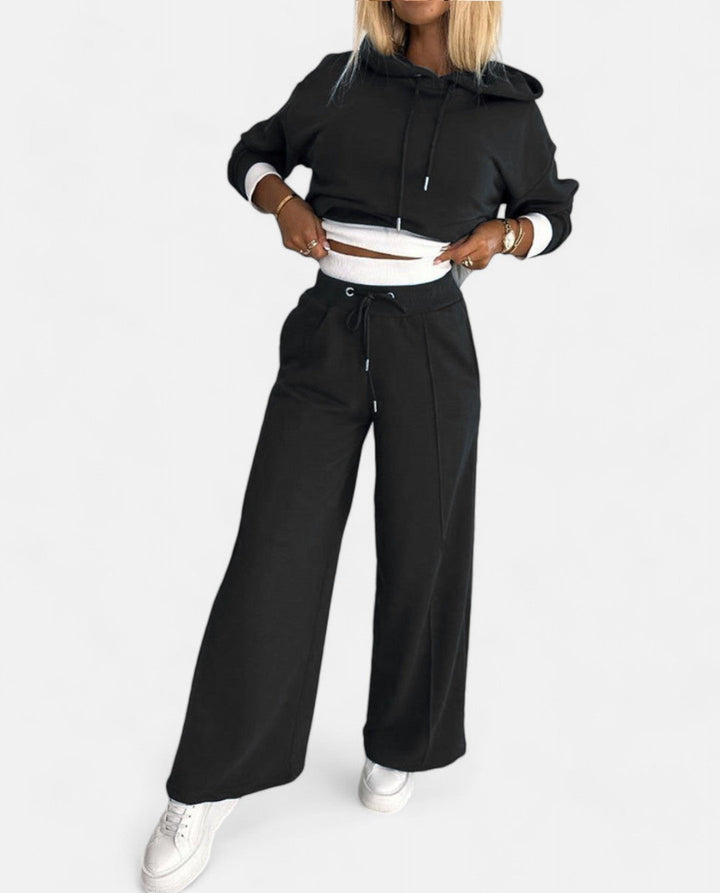 Women's two-tone hoodie & wide leg pants set. Stylish, comfortable loungewear for casual chic.
