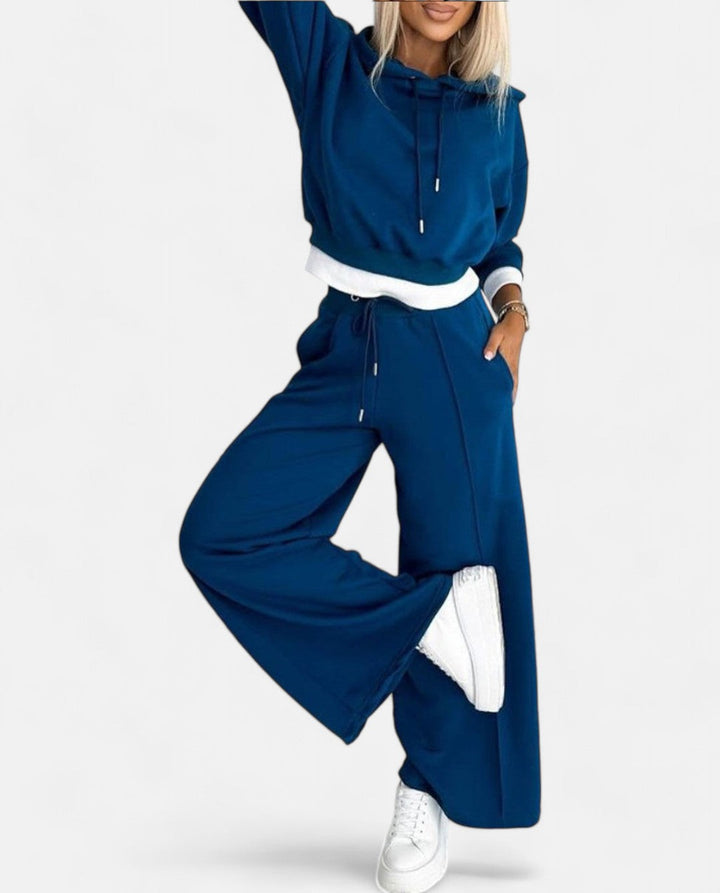 Soft women's two-tone hoodie and wide leg pants set, offering a modern, comfortable, and stylish look.