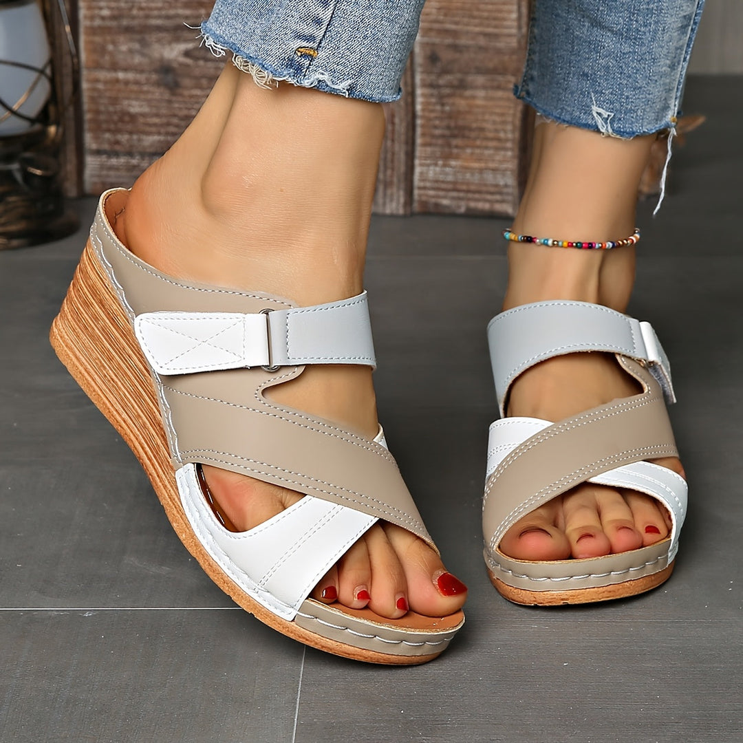 Stylish women's wedge slides, ideal for summer outfits, beach, or poolside casual footwear.