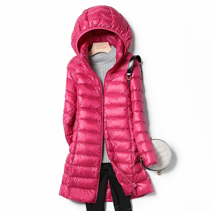 Travel-friendly women's ultra-light puffer, warm insulated jacket, essential winter outerwear.