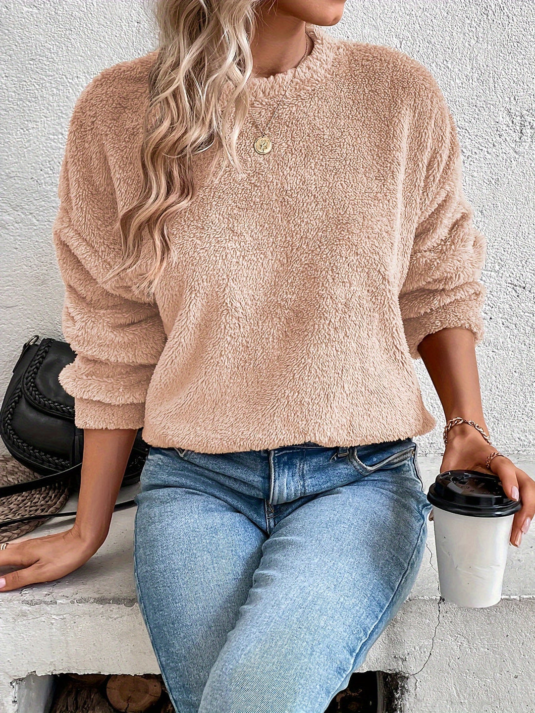 Women's ultra-soft fuzzy teddy pullover sweatshirt in a cozy round neck style for winter comfort & casual wear.