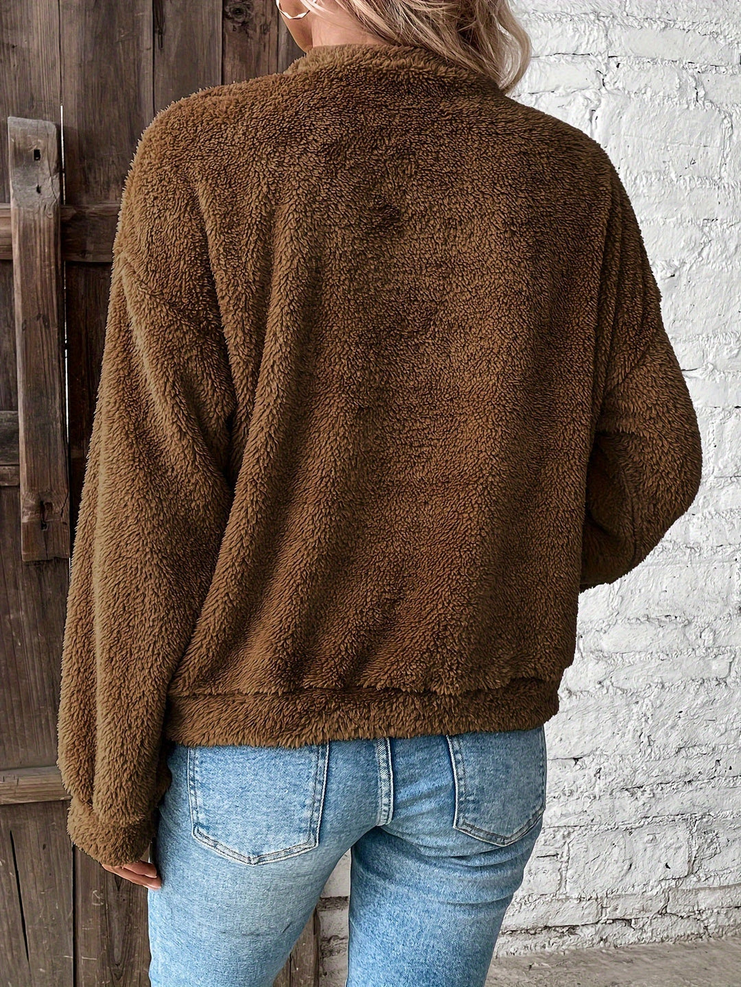 Casual & cozy women's fuzzy pullover sweatshirt. Soft teddy fabric, long-sleeve, perfect warm top for fall & winter comfort.