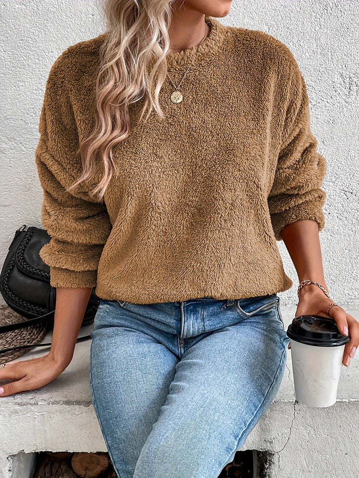 Cozy women's fuzzy teddy pullover sweatshirt, long sleeve for fall & winter fashion, perfect for soft, warm comfort.