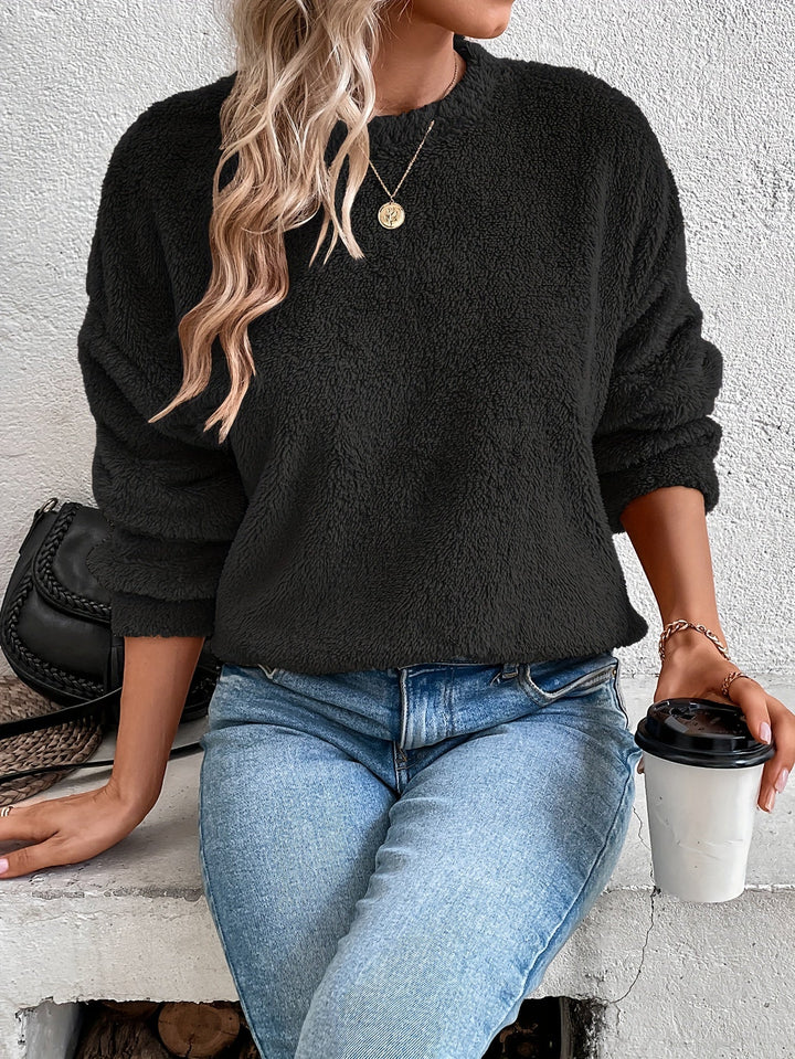 Soft Livia teddy pullover sweatshirt for women. Fuzzy, warm, & comfy long-sleeve, round-neck top for casual style.